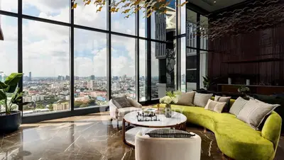 Luxurious living room with panoramic city views and elegant modern decor.