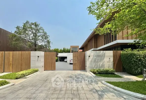 Stunning modern home with wooden facade and spacious driveway
