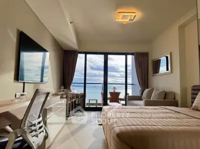 Luxurious bedroom with stunning ocean view and modern amenities.