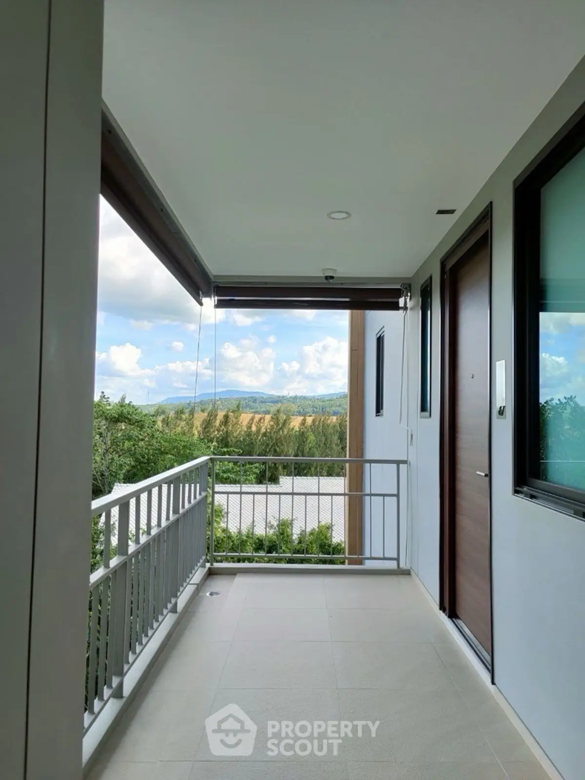 Modern balcony with scenic view and sleek design, perfect for relaxation and enjoying nature.