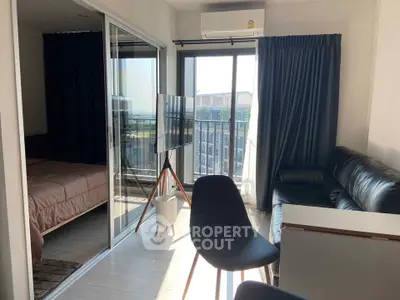 Modern condo living room with balcony and stylish furniture