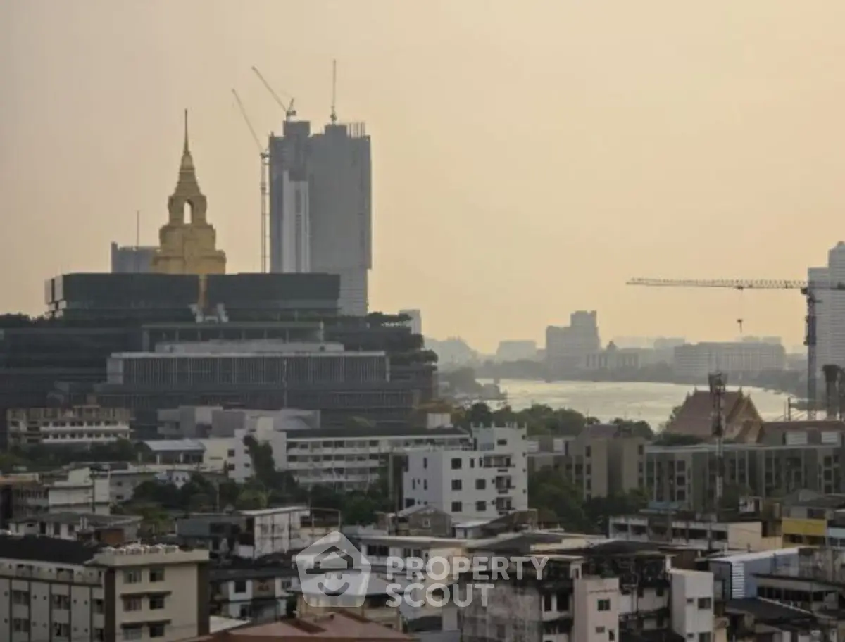 Stunning cityscape view with river and skyline, perfect for urban living enthusiasts.