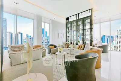 Luxurious high-rise living room with stunning city views and elegant modern decor.