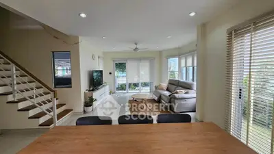 Spacious modern living room with natural light and stylish decor