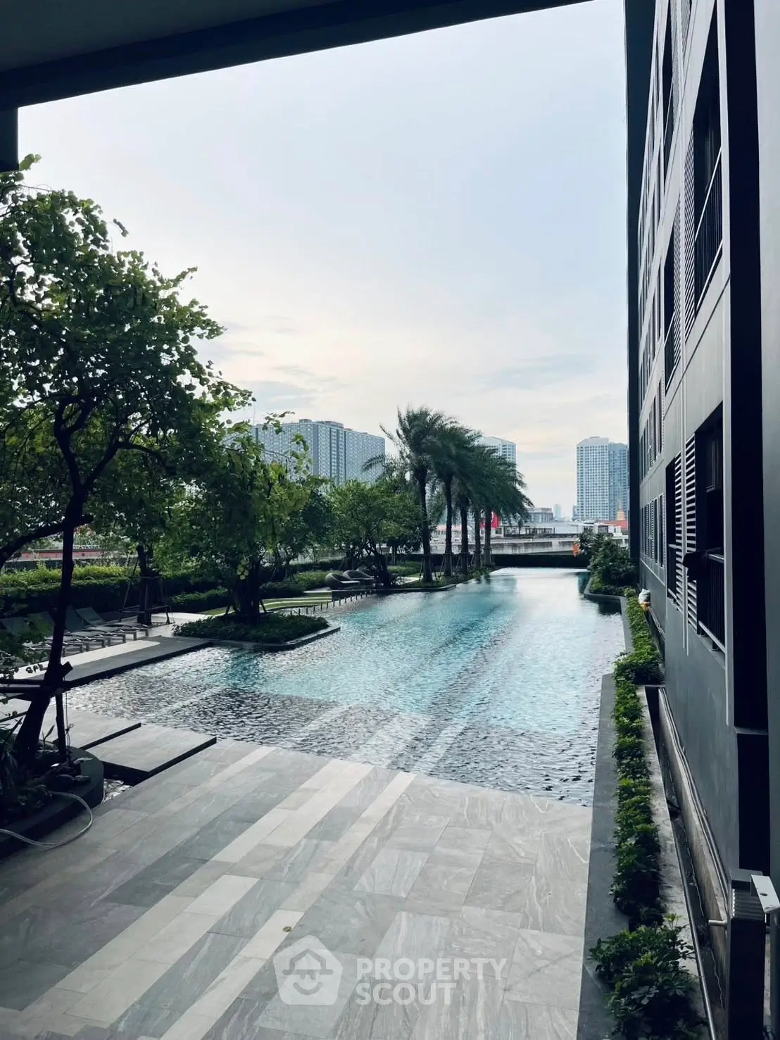 Luxurious modern apartment with stunning pool and city view