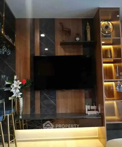 Luxurious living room with modern TV setup and elegant decor