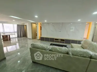 Spacious modern living room with marble flooring and elegant decor