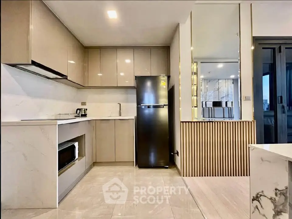 Modern kitchen with sleek cabinetry, stainless steel appliances, and elegant marble countertops.