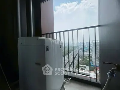 High-rise balcony with washing machine and stunning city view
