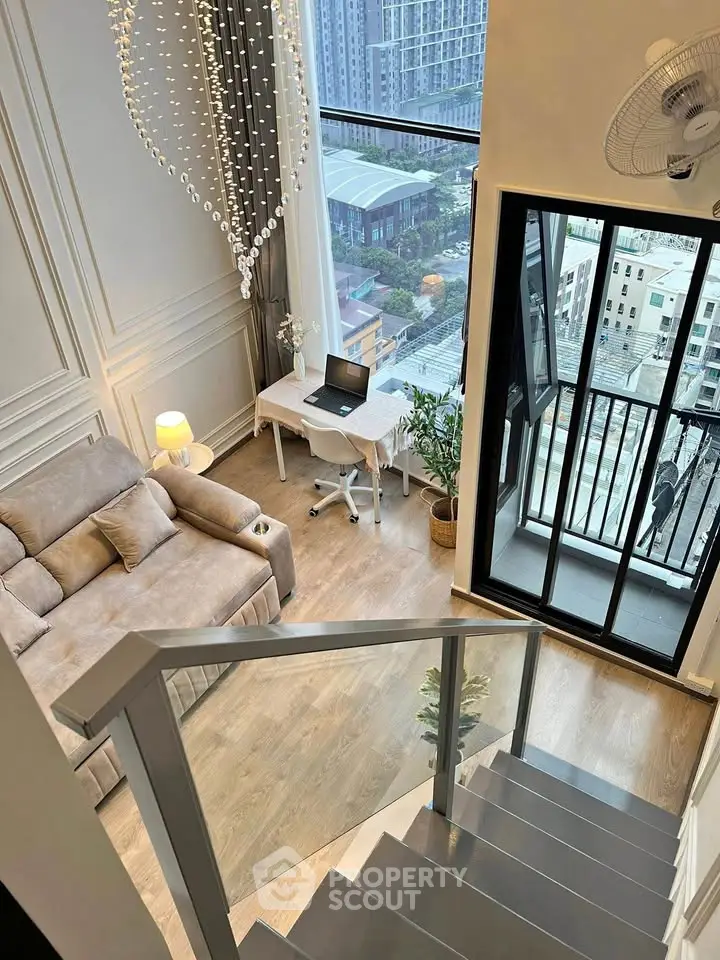 Modern loft apartment with stunning city view, featuring cozy living area and stylish workspace.