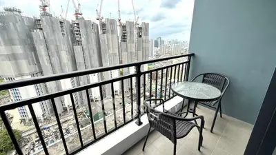 Modern balcony with city view, perfect for relaxation and enjoying urban skyline.