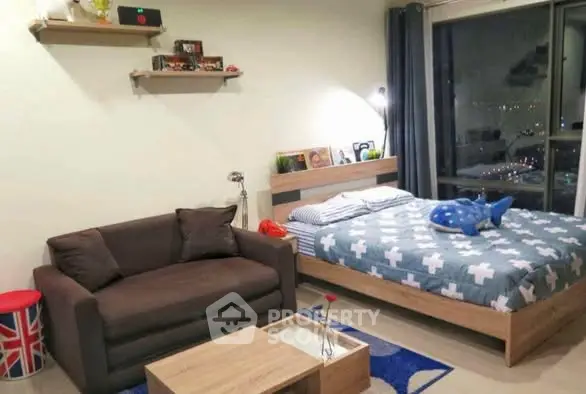 Modern bedroom with cozy sofa and large window view