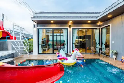 Modern villa with private pool and stylish outdoor seating area, perfect for relaxation and entertainment.