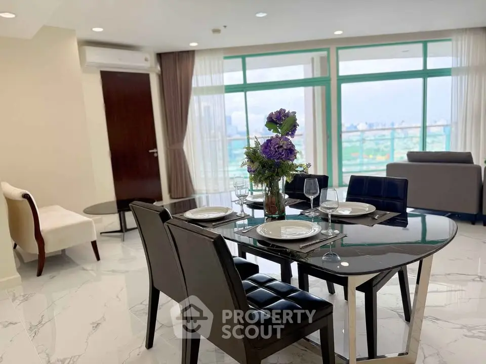 Elegant dining area with city view, modern furniture, and stylish decor in a luxurious apartment.