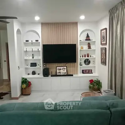 Modern living room with stylish built-in shelves and cozy seating area