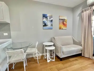 Cozy living room with modern furniture and stylish decor in a bright apartment.