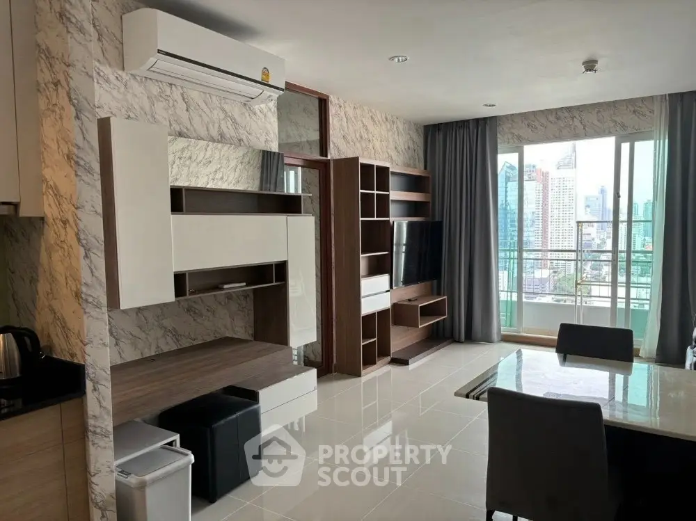 Modern living room with city view, sleek furniture, and marble accents.