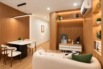 Modern living room with stylish wooden paneling and cozy seating area
