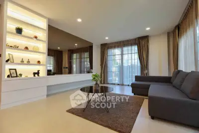 Spacious modern living room with elegant decor and large windows for natural light.