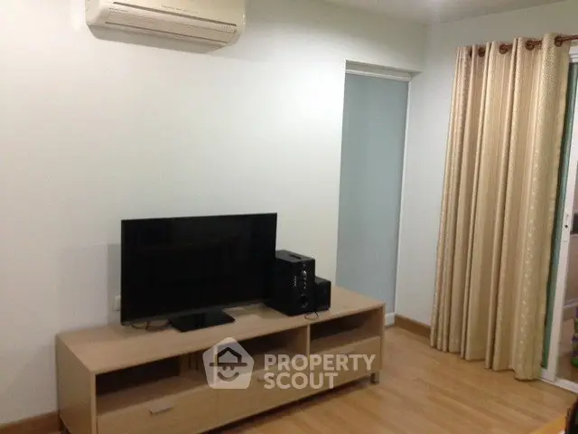 Modern living room with air conditioning and sleek TV setup