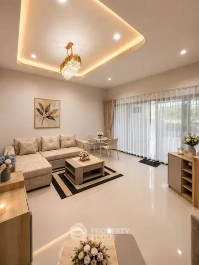 Elegant living room with modern chandelier and large windows for natural light