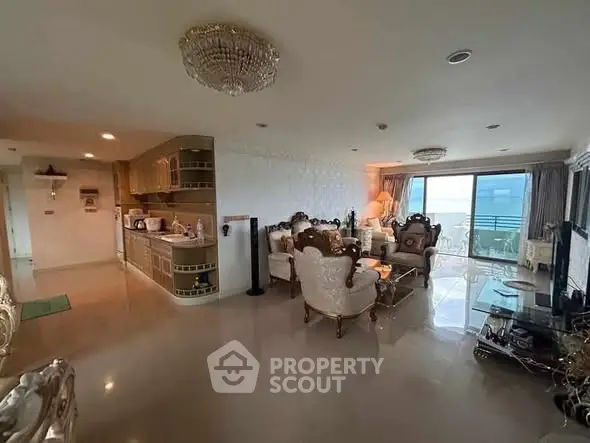 Luxurious living room with elegant furniture and ocean view balcony