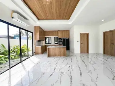 Modern kitchen with marble flooring and wooden ceiling accents