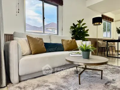 Stylish living room with modern decor, cozy sofa, and elegant coffee table, perfect for relaxation and entertaining.