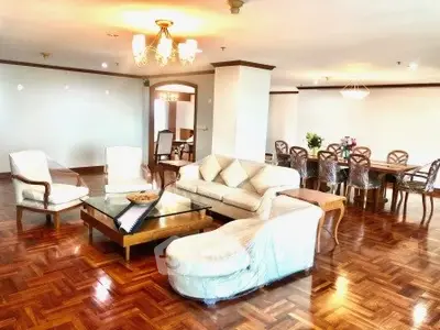 Spacious and elegant living room with wooden flooring and stylish furniture