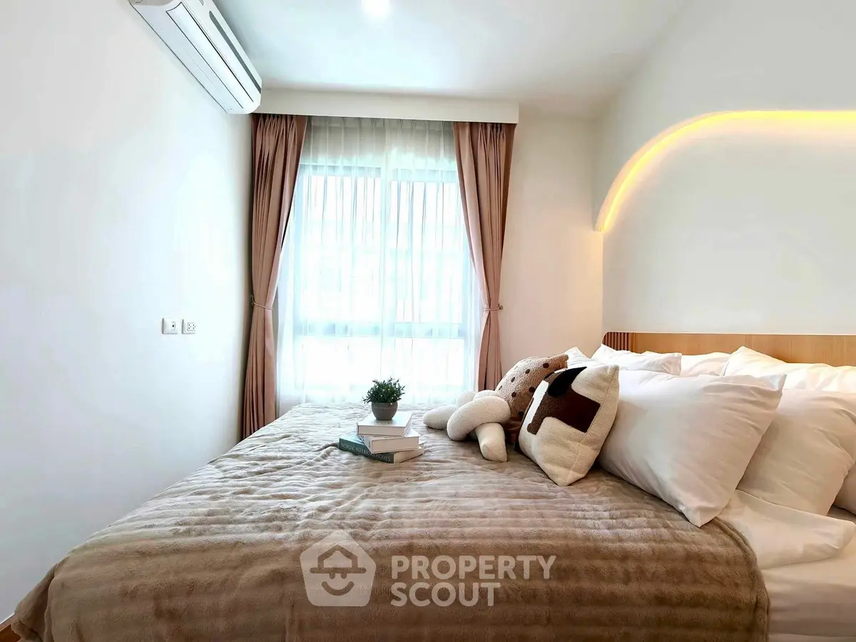 Cozy bedroom with plush bedding and soft lighting, perfect for relaxation.