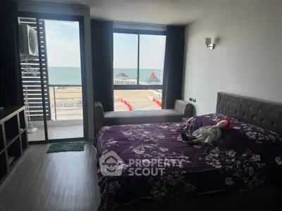 Stunning beachfront bedroom with ocean view and modern decor.