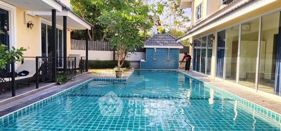 Luxurious private pool area with modern design and lush greenery, perfect for relaxation and entertainment.