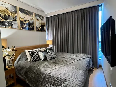 Luxurious bedroom with elegant decor and large window view