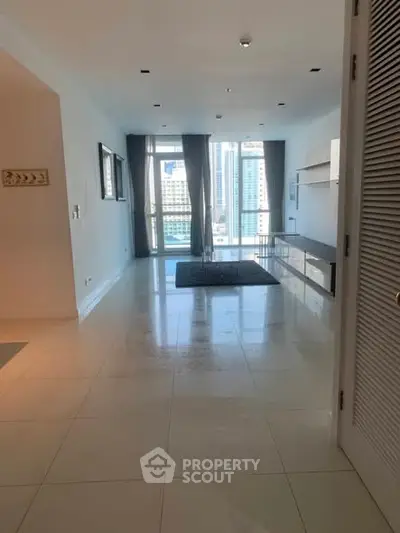 Spacious modern living room with city view and large windows