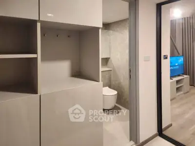 Modern apartment interior with sleek bathroom and living area view