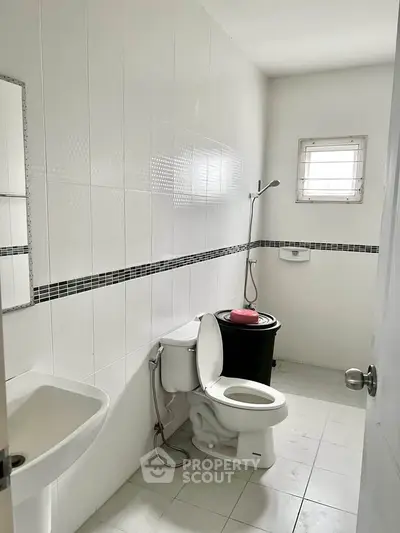 Spacious bathroom with modern fixtures and natural light
