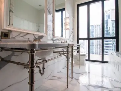 Luxurious marble bathroom with city view and elegant fixtures