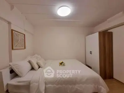 Cozy bedroom with modern decor and comfortable bedding