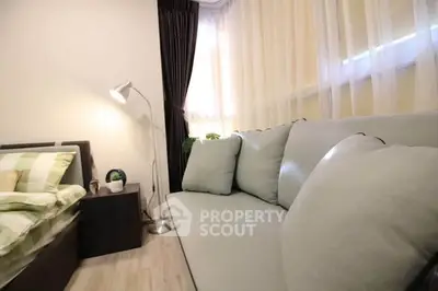 Cozy bedroom with stylish sofa and modern decor
