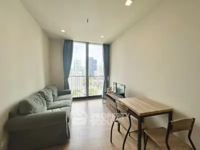 Modern living room with city view, featuring cozy sofa and dining area, perfect for urban living.