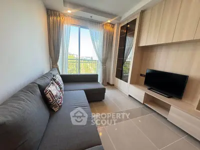 Modern living room with sleek furniture and large window view