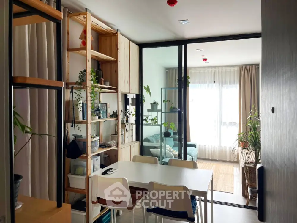Modern apartment with open living and dining area featuring stylish decor and natural light.