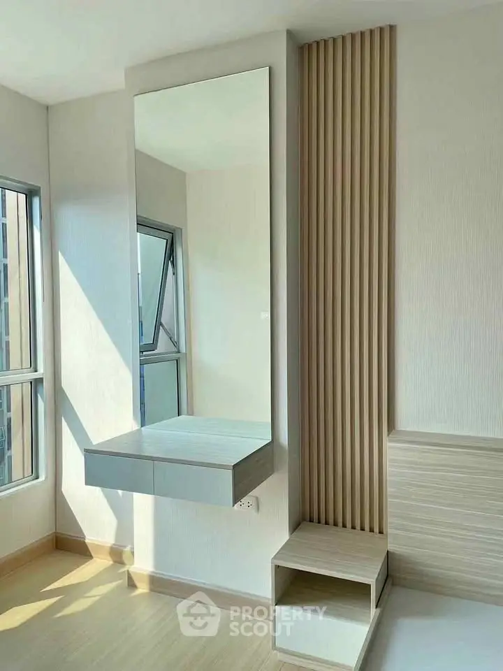 Modern minimalist bedroom with natural light and stylish wall paneling
