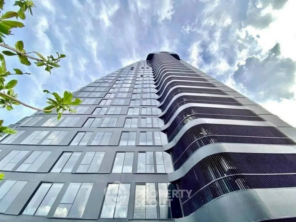 Stunning modern high-rise building with sleek architectural design and expansive windows.