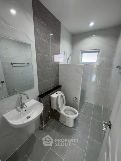 Modern bathroom with sleek tiles and contemporary fixtures
