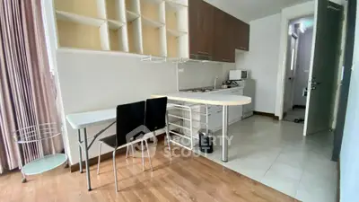 Modern kitchen with open layout and dining area in a stylish apartment