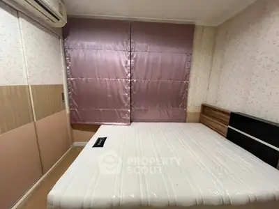 Cozy bedroom with modern design and ample natural light