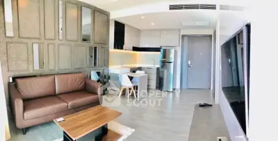 Modern open-plan living room with sleek kitchen and stylish decor