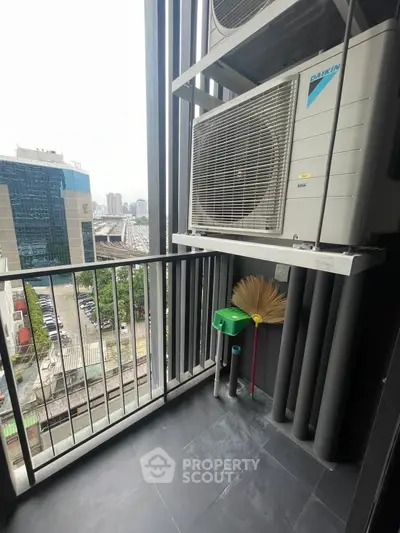 Modern balcony with city view and air conditioning unit, perfect for urban living.