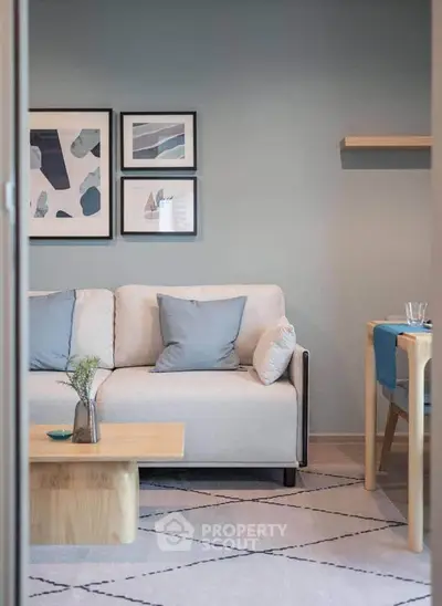 Stylish modern living room with cozy sofa and elegant decor in a chic apartment.